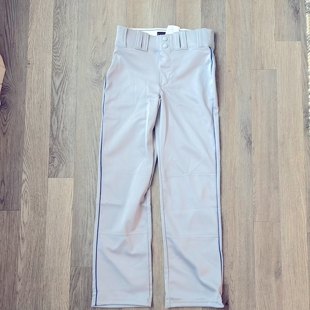 Youth medium, open bottom under armor, baseball pants with blue pinstripe.
